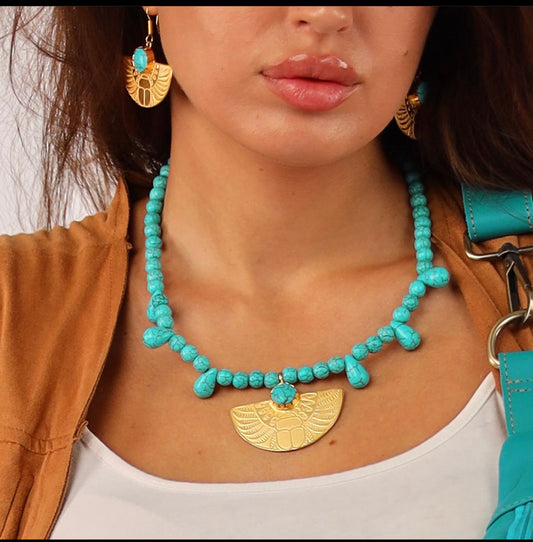 Turquoise stone necklace with isis wings pendant