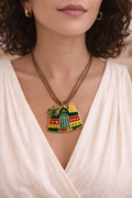 Nubian house pendant with leather necklace